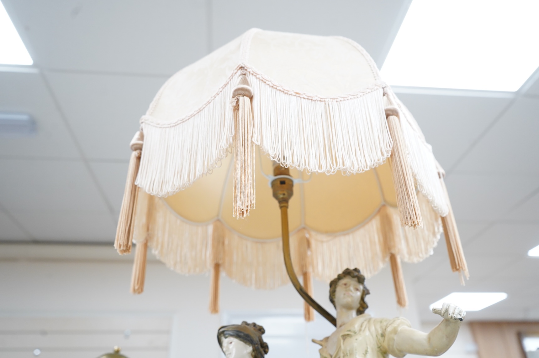 A figural spelter lamp with shade, 90cm high